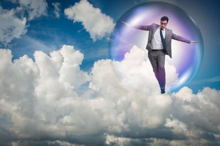Businessman flying inside the bubbleの写真素材