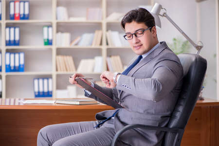 Young businessman working in the officeの写真素材