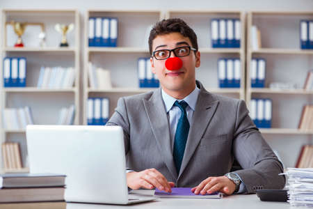 Clown businessman working in the officeの写真素材