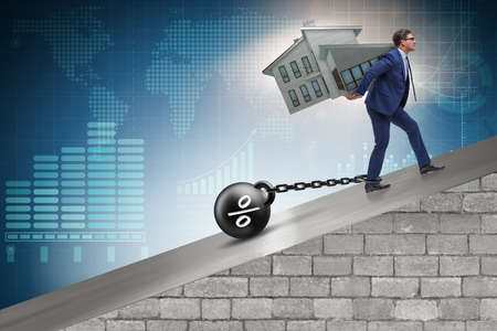 Businessman in mortgage debt financing conceptの写真素材