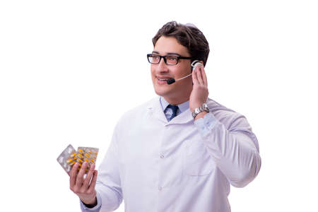 Young doctor with phone headset isolated on whiteの写真素材