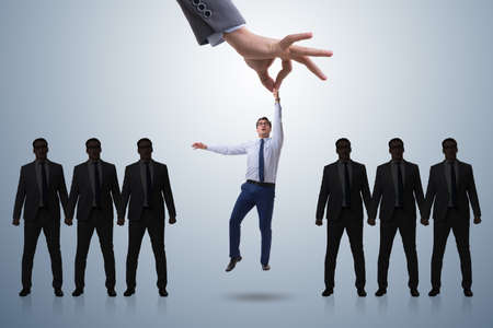 Recruitment concept with hand picking employeeの写真素材