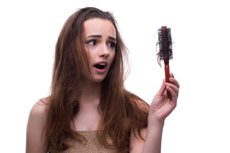 Woman in beauty concept combing hair loosig lossの写真素材