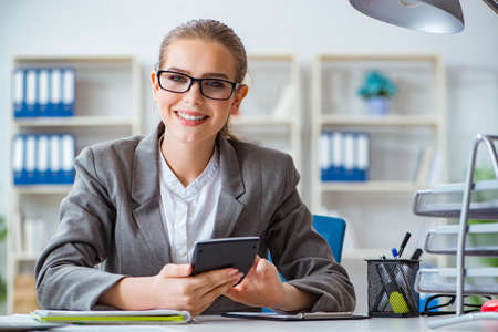 Young businesswoman accountant working in the officeの写真素材