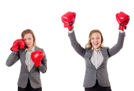 Woman businesswoman with boxing gloves on whiteの写真素材