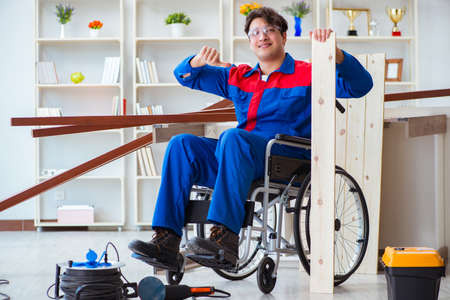 Disabled carpenter working in workshopの写真素材