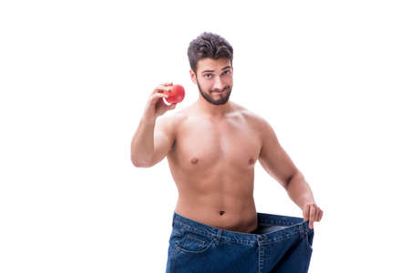 Man in dieting concept with oversized jeansの写真素材