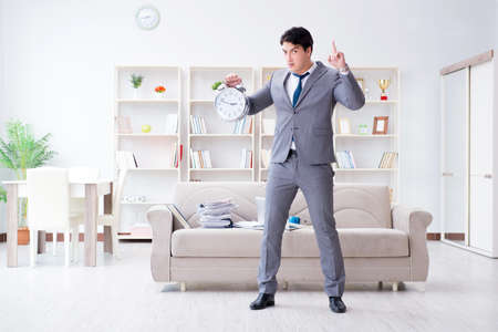 Businessman failing to meet his deadlinesの写真素材