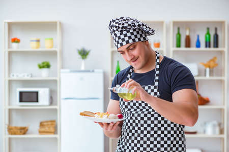 Chef cook cooking a meal breakfast dinner in the kitchenの写真素材
