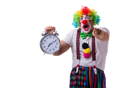 Funny clown with an alarm clock isolated on white backgroundの写真素材