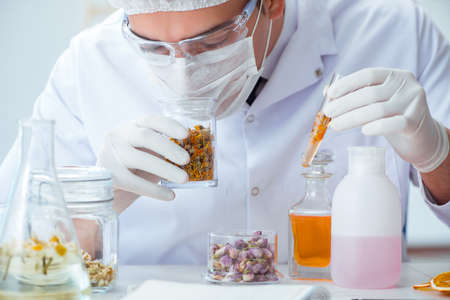 Chemist mixing perfumes in the lab