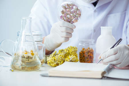 Chemist mixing perfumes in the lab
