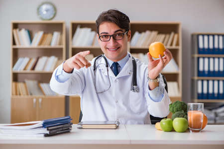 Scientist studying nutrition in various foodの写真素材