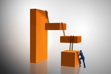 Businessman climbing blocks in challenge business conceptの写真素材