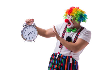 Funny clown with an alarm clock isolated on white backgroundの写真素材