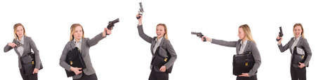 Businesswoman with gun isolated on whiteの写真素材
