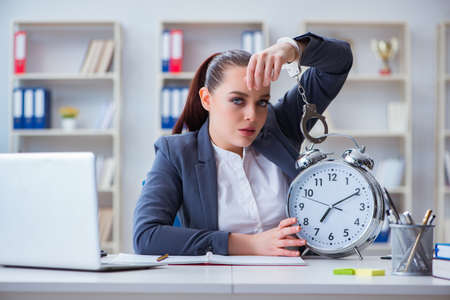 Businesswoman in time management conceptの写真素材