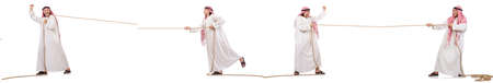 Arab in tug of war concept on whiteの写真素材