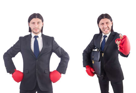 Businessman with boxing gloves on whiteの写真素材