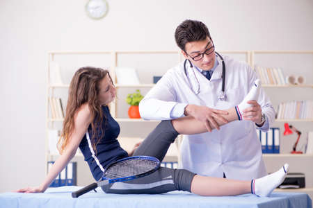 Man doctor taking care of sports injury