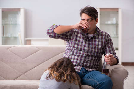 Drinking problem drunk husband man in a young family conceptの写真素材