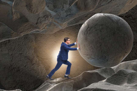 Businessman in difficult challenge conceptの写真素材