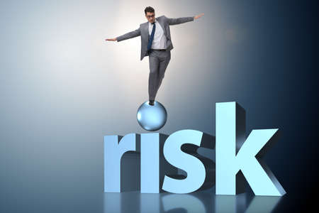 Young businessman in business risk and uncertainty conceptの写真素材