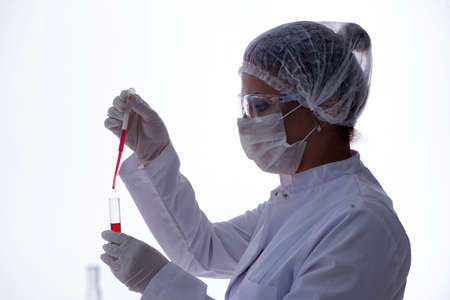 Female scientist researcher conducting an experiment in a labora