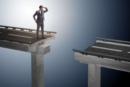 Businessman ready to overcome the broken bridgeの写真素材