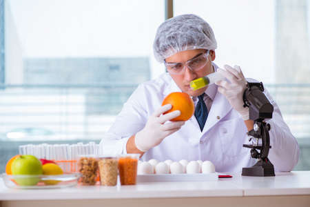 Nutrition expert testing food products in labの写真素材