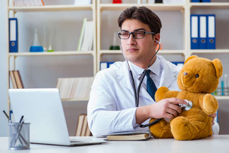 Doctor veterinary pediatrician holding an examination in the offの写真素材