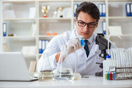 Young researcher scientist doing a water test contamination expeの写真素材