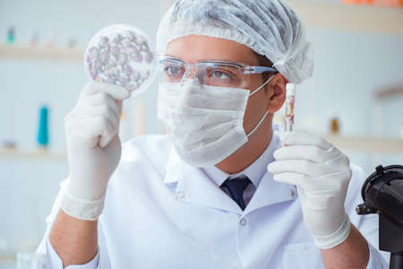 Chemist mixing perfumes in the lab