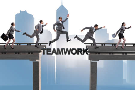 Teamwork concept with business people crossing bridgeの写真素材