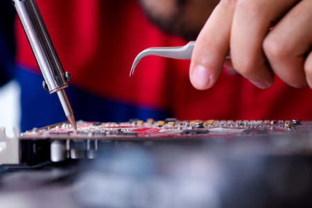 Repairman working in technical support fixing computer laptop trの写真素材