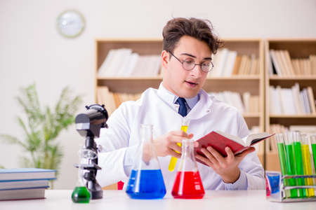 Mad crazy scientist doctor doing experiments in a laboratory