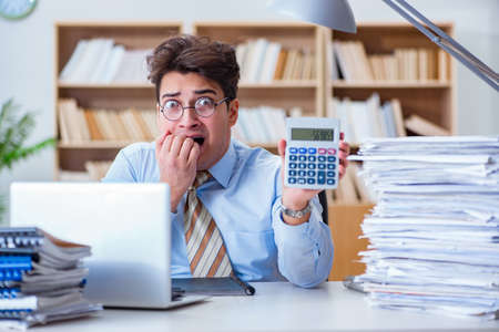 Funny accountant bookkeeper working in the officeの写真素材