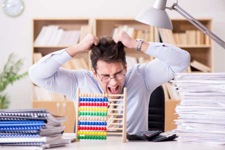 Funny accountant bookkeeper working in the officeの写真素材