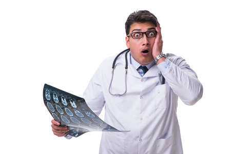 Young male doctor holding a radiograph isolated on white backgroの写真素材