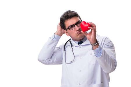 Young male cardiologist doctor holding a heart isolated on whiteの写真素材