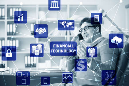 Businessman talking on smartphone in fintech concept