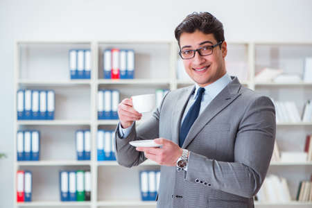 Young businessman working in the officeの写真素材