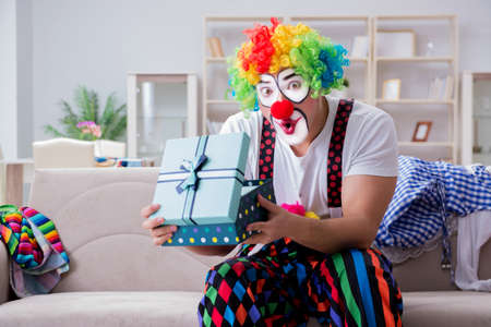 Drunk clown celebrating having a party at home