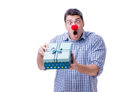 Man with a red nose funny holding a shopping bag gift present isの写真素材