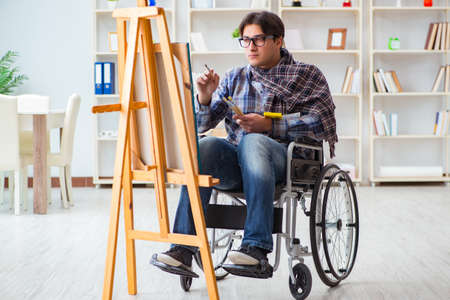 Disabled artist painting picture in studio