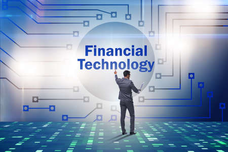 Businessman pressing buttons in fintech conceptの写真素材