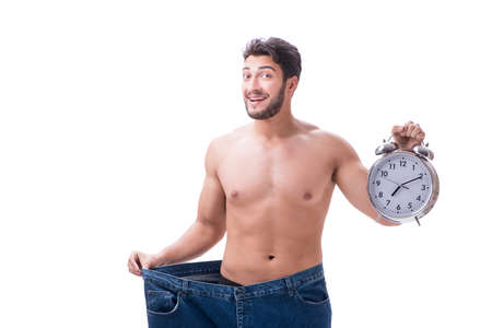 Man in dieting concept with oversized jeansの写真素材