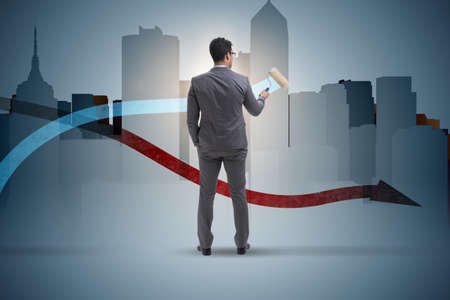 Businessman drawing charts in forecasting conceptの写真素材