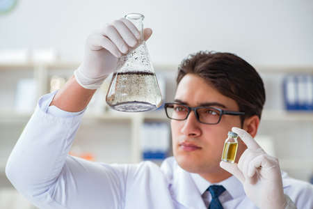 Young researcher scientist doing a water test contamination expeの写真素材