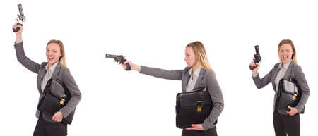 Businesswoman with gun isolated on whiteの写真素材
